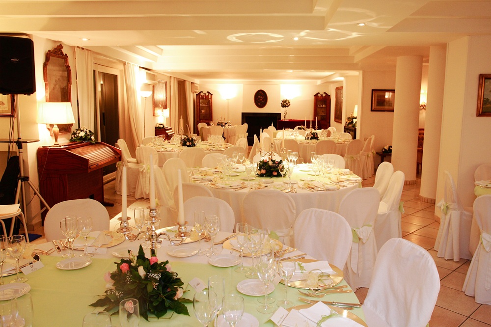 Business conference stage setup and wedding reception room with festively decorated tables